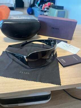Prada SPR 57L Shield Sunglasses Gunmetal Grey Gradient 120